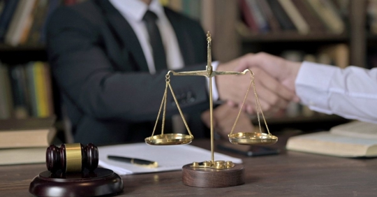 lawyer and client handshake