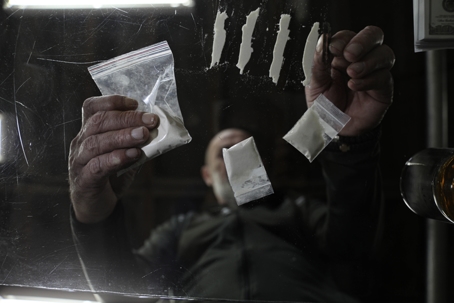 man with drug paraphernalia